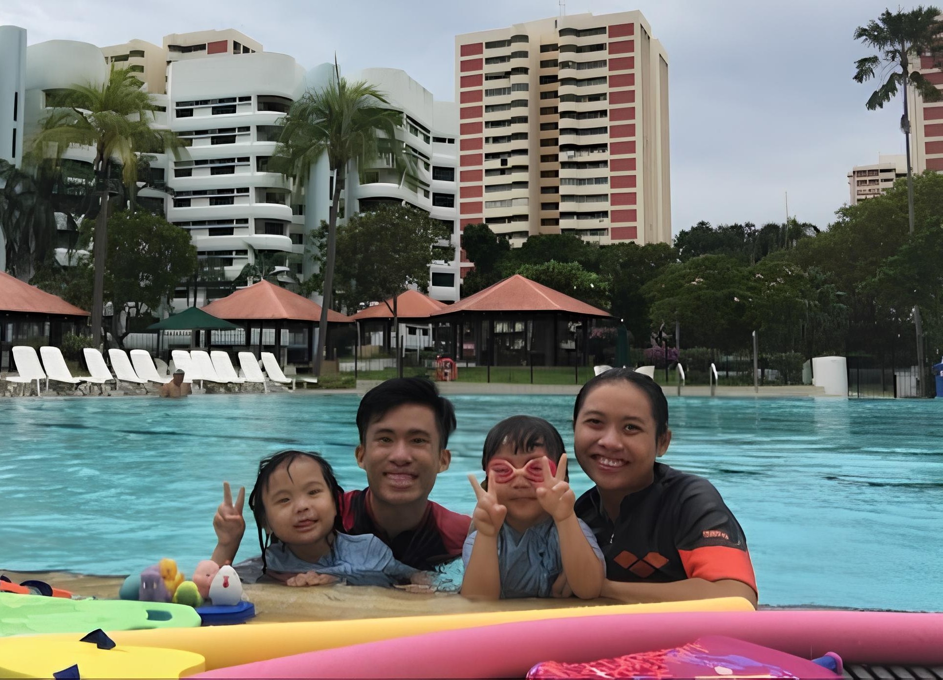 The two BeyondSplash founder coaches in the pool with young swimmers
